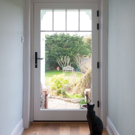 fully glazed side door painted white in timber