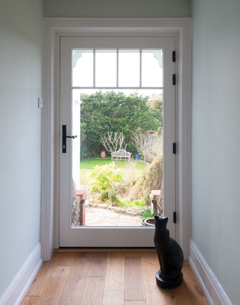 fully glazed side door painted white in timber