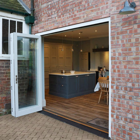 traditional timber bifold doors open