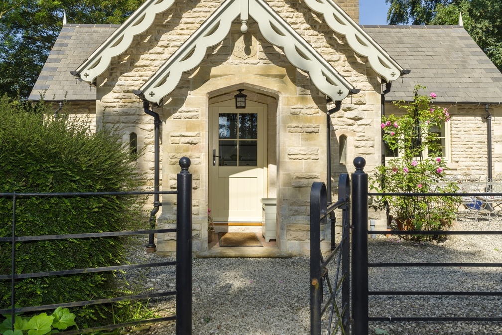 side door on a stone cottage with glass panel and glazing bars