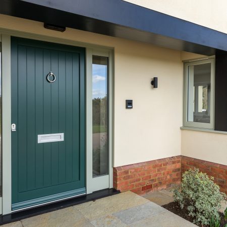 Modern Grandis hardwood entrance door and sidelights (LG 306 Three Farm green and frames in Normandy grey to match the windows)