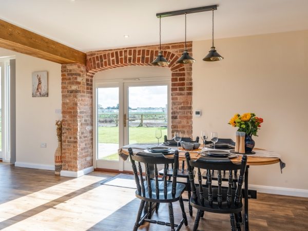 interior view of a country style kitchen with arched top french doors