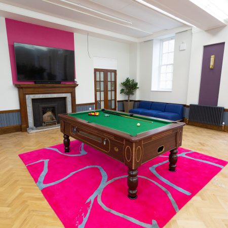 Games room relaxation area with arch topped french doors and sliding sash windows.