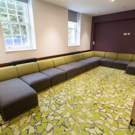 Communal lounge area with corner settee and two sets of sliding sash windows from George Barnsdale