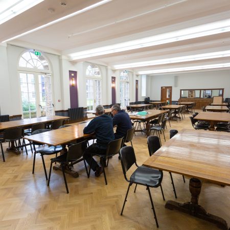 Dining hall with 3 sets of arch topped french door sets at Florence Boot Hall