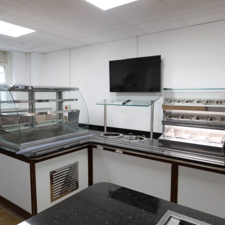 University refectory area with sliding sash window in background