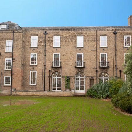 External photo of florence boot hall showing juliet balcony, arch topped french doors and sliding sash windows