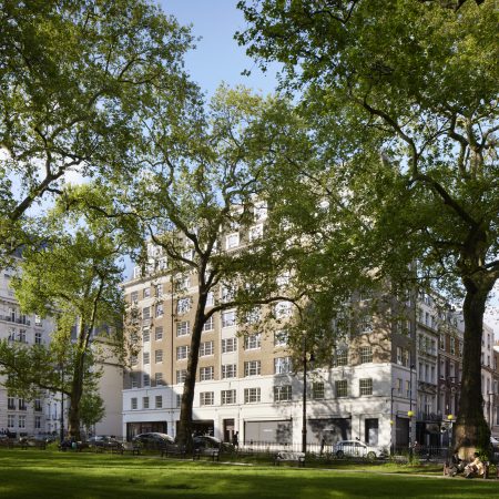 photo of art deco building Twenty Berkeley Square London behind large trees with George Barnsdale timber sliding sash windows